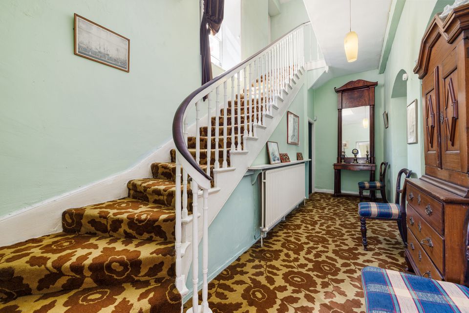 The hall and stairs at Glebe House
